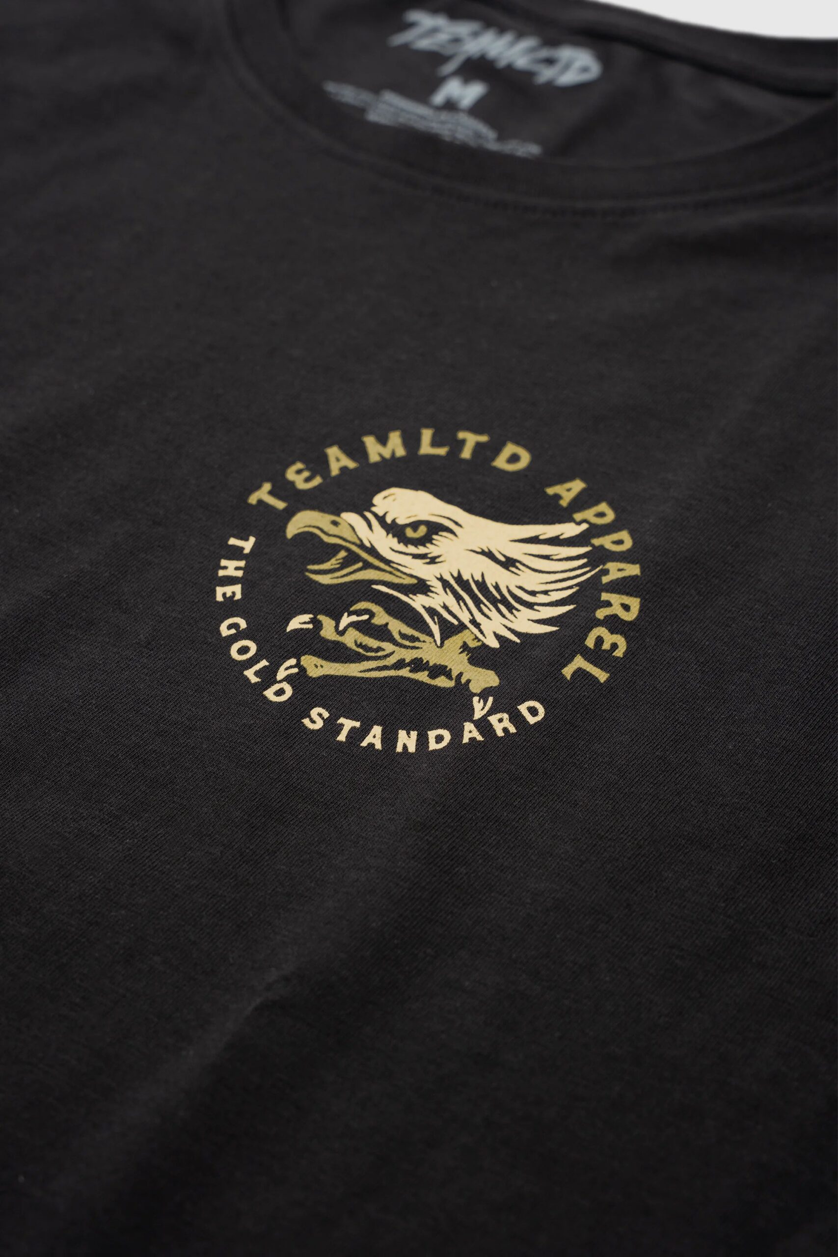 Capsule-Tee-Gold-DetailA.jpg Capsule-Tee-Gold-DetailA.jpg